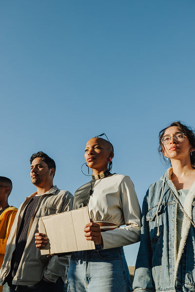 Group of diverse young adults at a peaceful outdoor protest