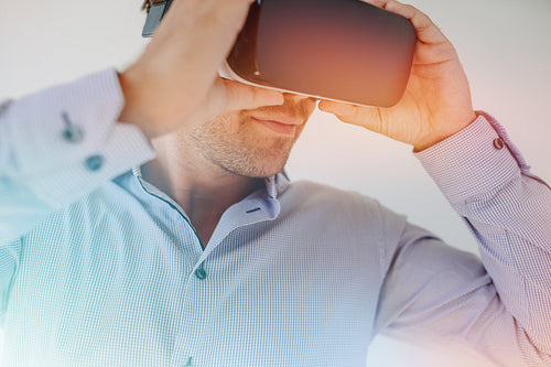  Young man using VR glasses