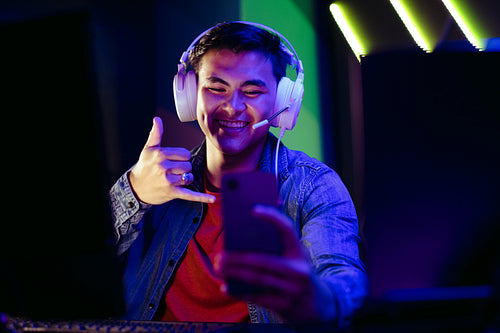 Gen Z gamer connecting to a live video streaming on a mobile gaming app