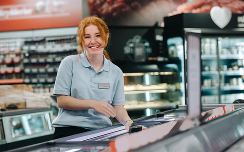 Woman doing a holiday job at grocery store