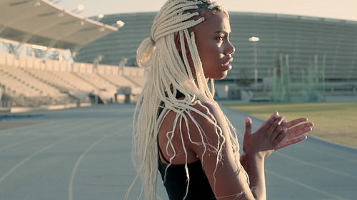Sports woman on race track during cold morning
