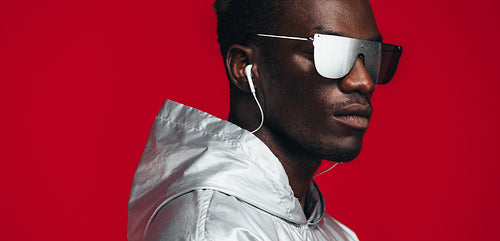 Young guy styled in futuristic outfit