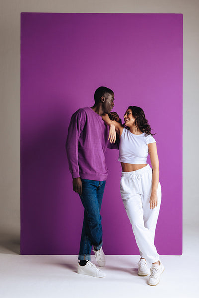 Fashionable and happy couple having a casual conversation in a studio