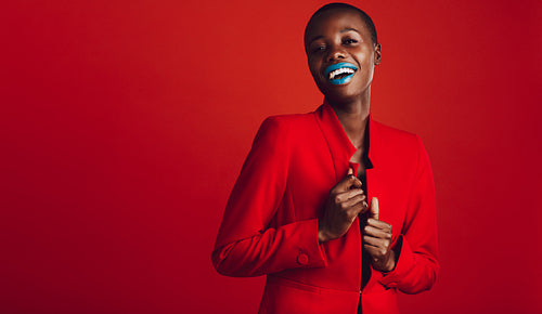 Fashionable woman looking at camera and smiling