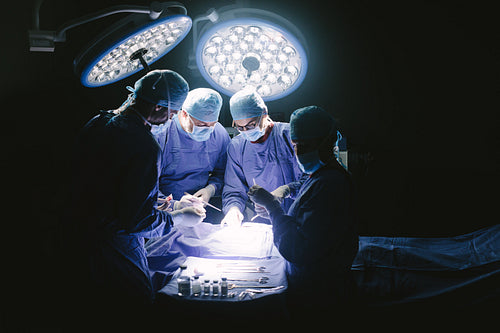 Team of professional surgeons performing surgery