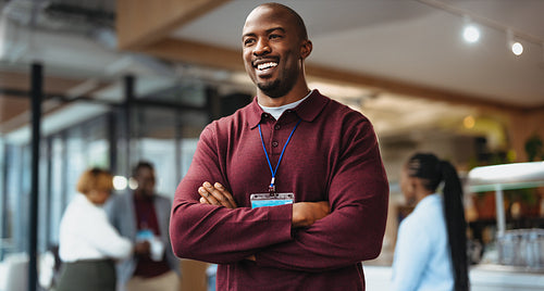 Accomplished young businessman attending a convention in an office environment
