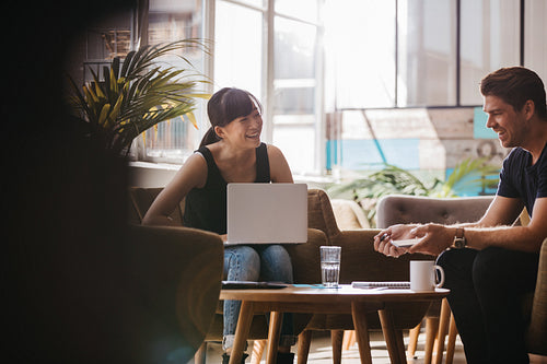 Business partners having a meeting in office lobby