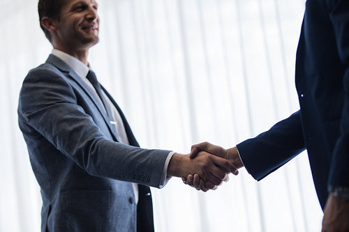 Business partners shaking hands 