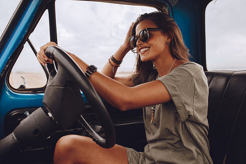 Beautiful woman driving a truck