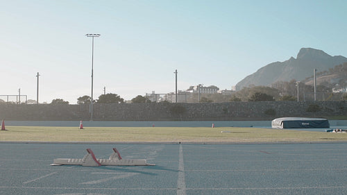 Female athlete at starting blocks