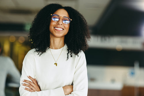 Confident young businesswoman smiling at the camera