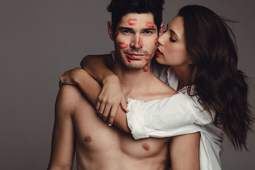 Passionate couple on grey background