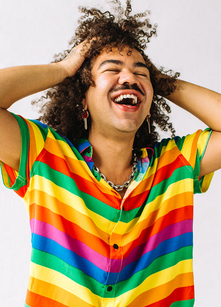 Ecstatic gay man standing in a studio