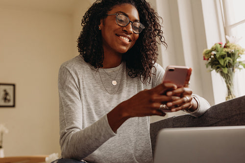 Businesswoman working from home on laptop