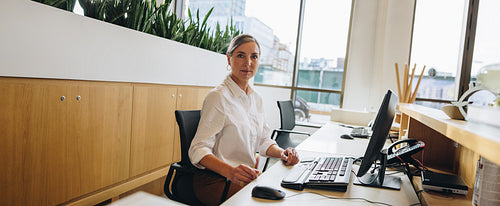 Receptionist at front desk in office