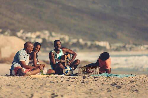 Friends on vacation relaxing at the beach
