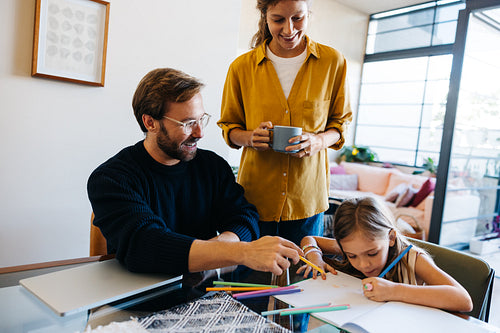 Family drawing session at home with parents