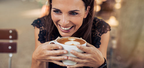 Young woman enjoying a cup of coffee