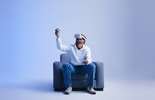 Young man playing a virtual reality game