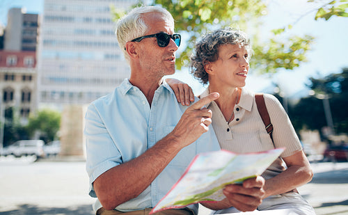 Tourist using city map for directions