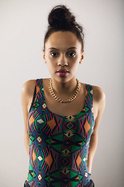 Attractive young woman in casual outfit looking at camera