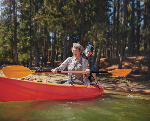 Mature couple having fun at the lake with kayak