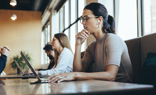 Young businesswoman having a virtual meeting in a co-working spa
