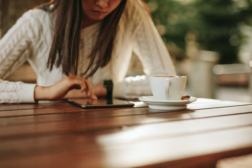Woman using with tablet at cafe