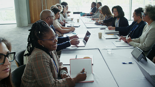 Professionals exchanging ideas in a boardroom meeting