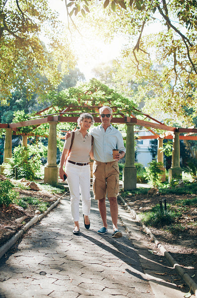 Loving senior couple walking in a park