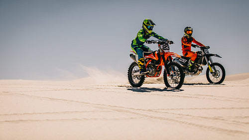 Motocross bikers in desert