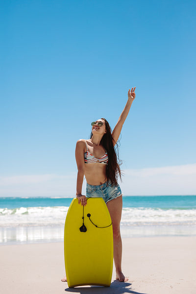 Woman surfer enjoying bodyboarding