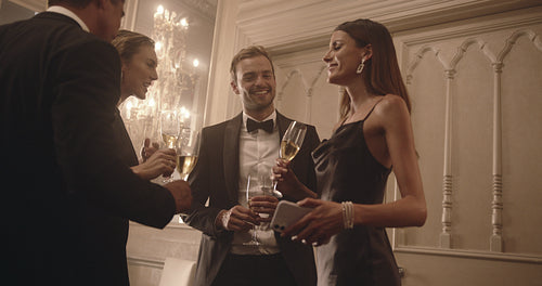 Woman taking a selfie with friends at party