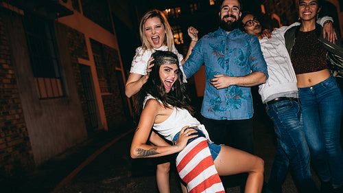 Young woman enjoying party with her friends