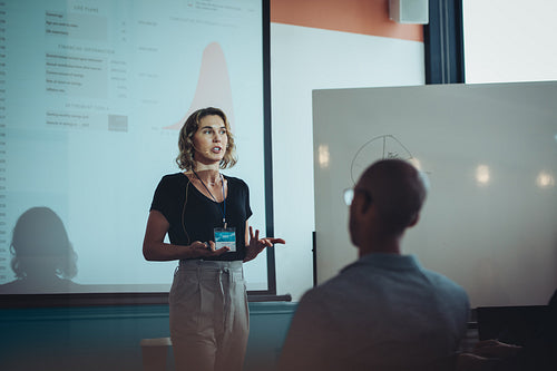Woman addressing a business conference