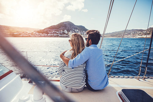 Young couple in love enjoying the boat trip