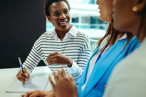 Productive corporate meeting with engaged diverse colleagues