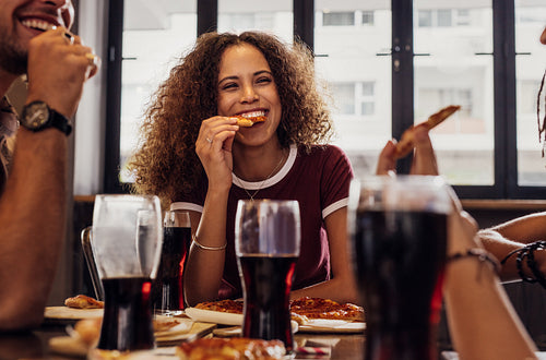 Woman with friends enjoying a meal