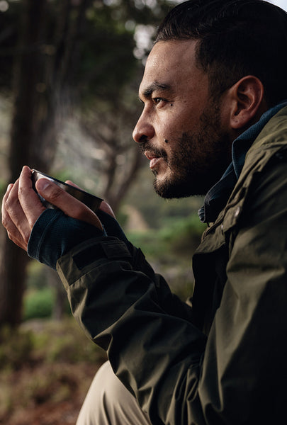 Hiker taking rest and drinking fresh coffee