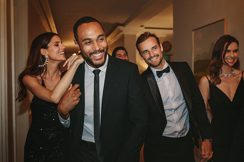 Friends having fun together at a gala event.