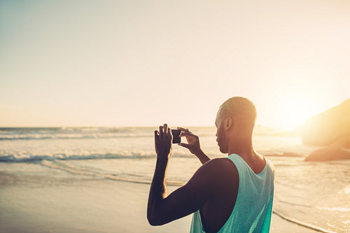 Afro american man taking photo
