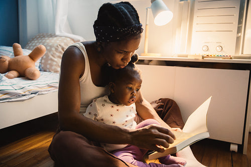Mother reading with her daughter