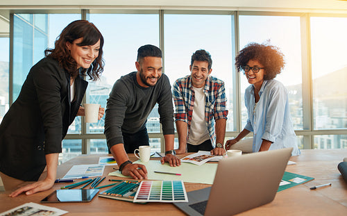 Man discussing new designs and color scheme with colleagues 