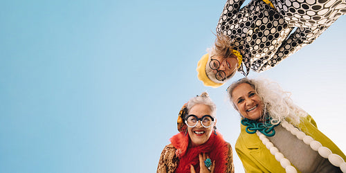 Low angle view of happy senior women smiling at the camera
