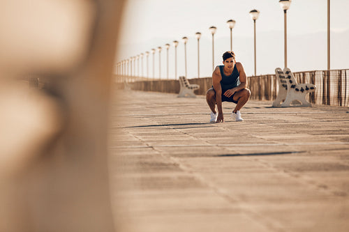 Healthy man taking a break after morning run
