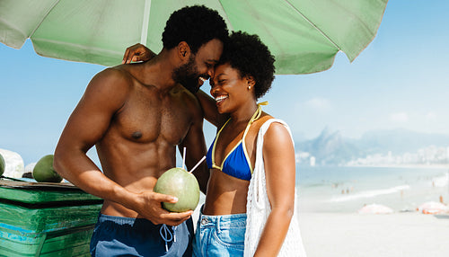 Affectionate couple enjoying holiday on a Brazilian beach