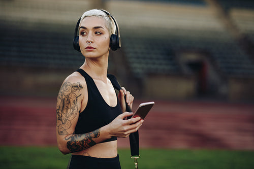 Portrait of a female athlete in a stadium