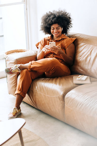 Happy female entrepreneur having a video call on a smartphone