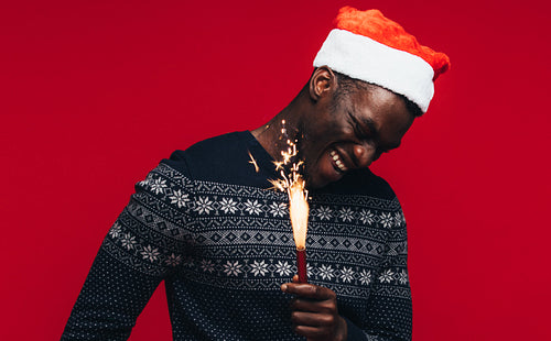Man celebrating christmas with firework