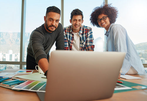 Creative start-up team discussing ideas in business meeting